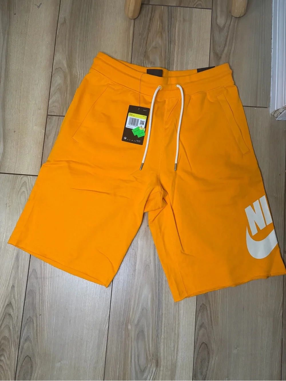Nike Bright Orange Athletic Shorts with White Swoosh Tag
